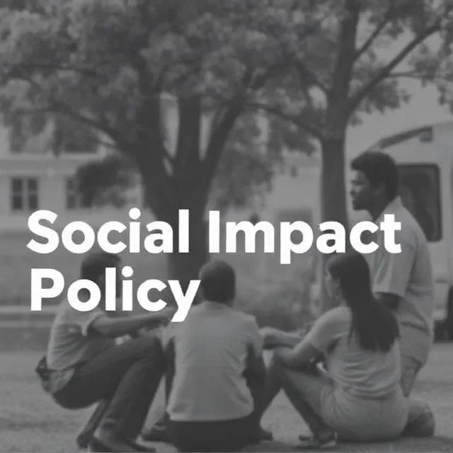 Group of people discussing social impact policy outdoors.