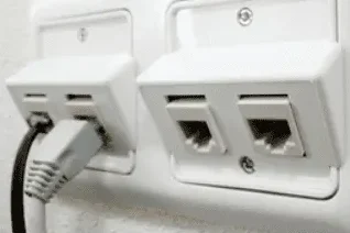 wall jacks A white wall outlet with two Ethernet ports and one connected cable.